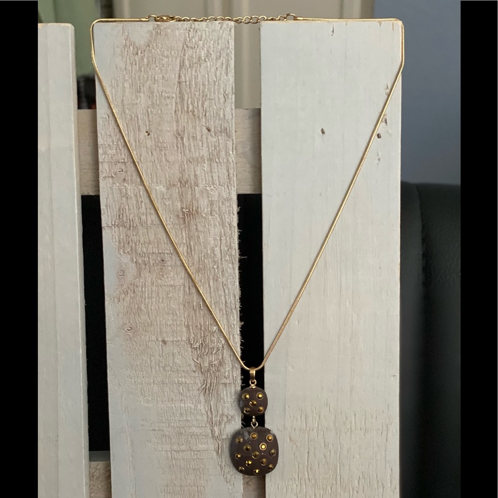 Gold drop modern necklace with yellow stones